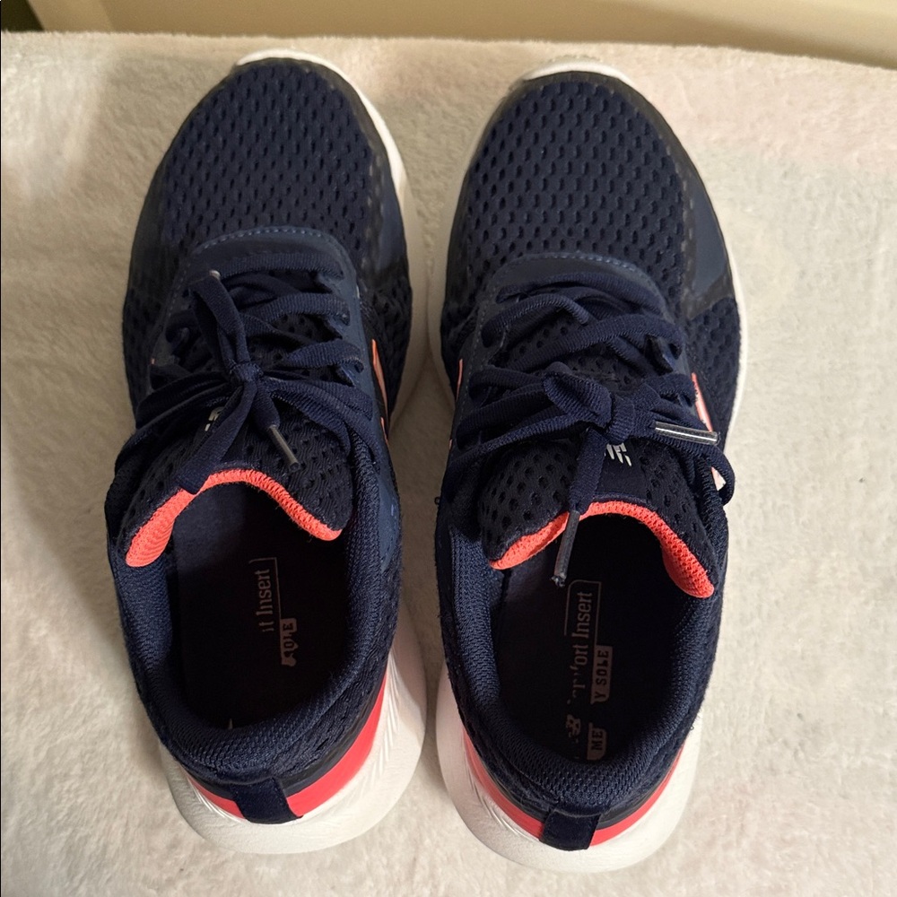 Navy and Pink women’s New Balance Athletic Shoes